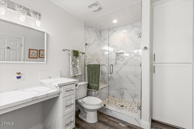 17600 Ascot Ct, Tehachapi, CA 93561 - bathroom with vanity, a marble finish shower, wood finished floors, and recessed lighting