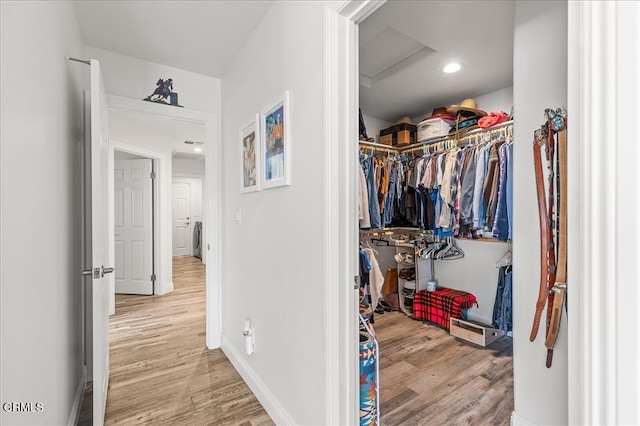 17600 Ascot Ct, Tehachapi, CA 93561 - spacious closet with light wood-type flooring and attic access