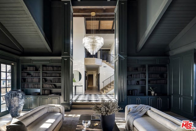 living room featuring lofted ceiling and a chandelier