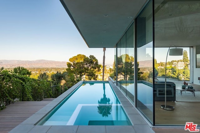 view of pool with a mountain view