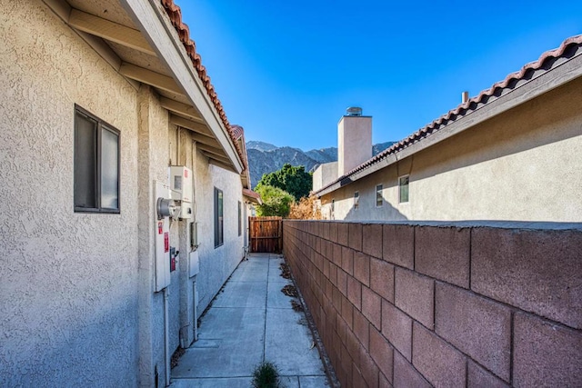 view of property exterior featuring a mountain view