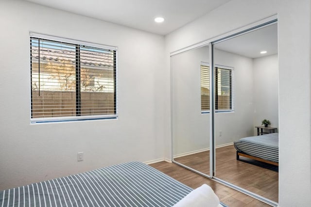 bedroom featuring hardwood / wood-style flooring and a closet