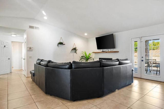 tiled living room with vaulted ceiling