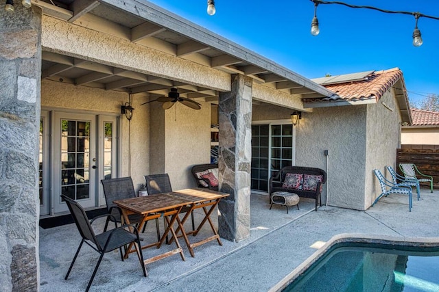 view of patio featuring ceiling fan