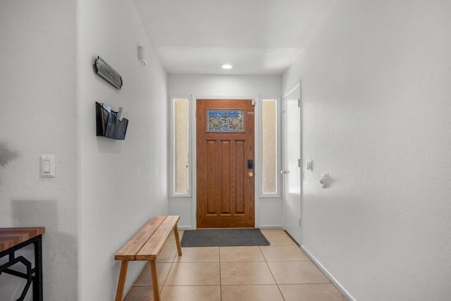 foyer featuring light tile patterned flooring