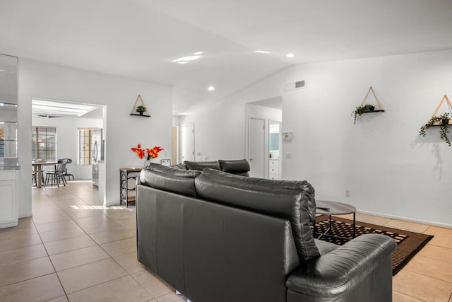 tiled living room featuring lofted ceiling