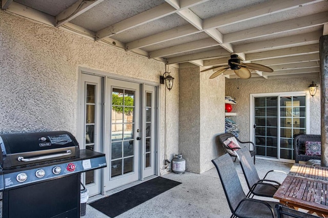 view of patio with grilling area and ceiling fan