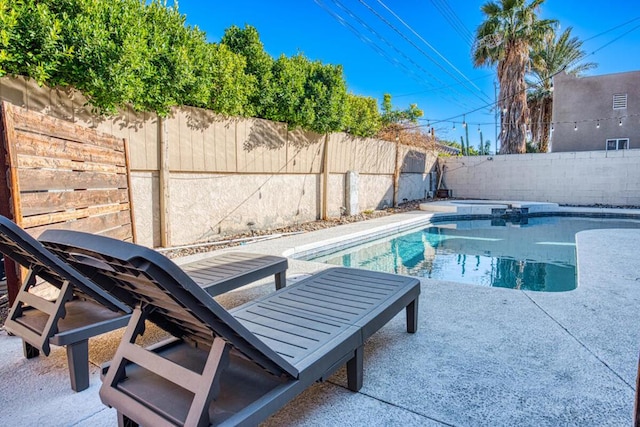 view of swimming pool with a patio area