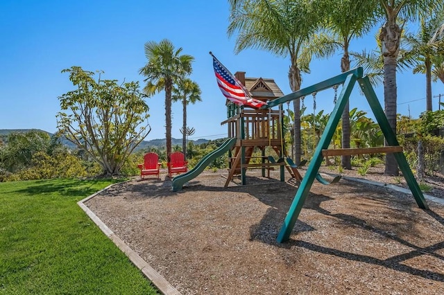 view of playground with a yard