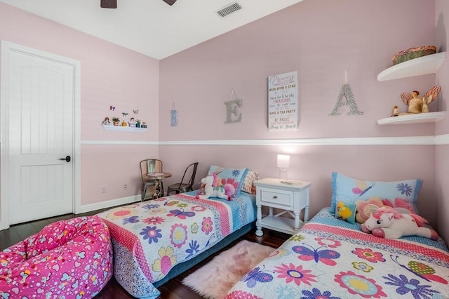 bedroom featuring ceiling fan and dark hardwood / wood-style flooring