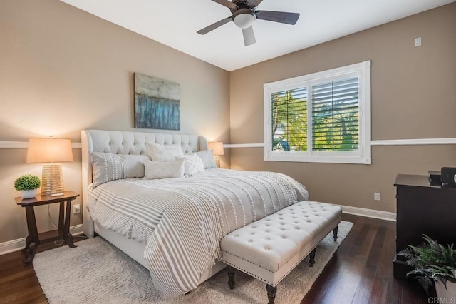 bedroom with dark hardwood / wood-style floors and ceiling fan