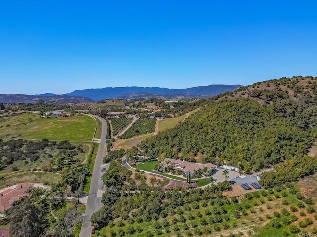 drone / aerial view with a mountain view and a rural view