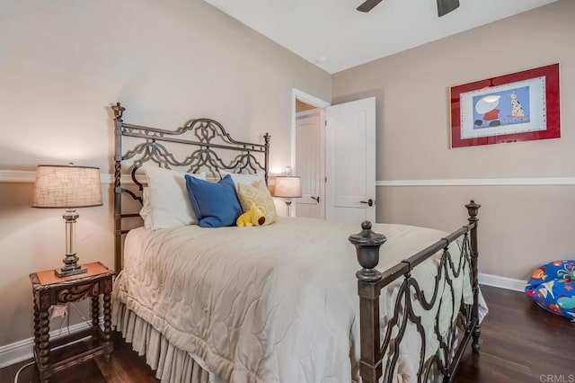 bedroom featuring dark hardwood / wood-style flooring and ceiling fan