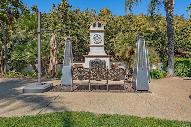 view of patio / terrace featuring exterior fireplace