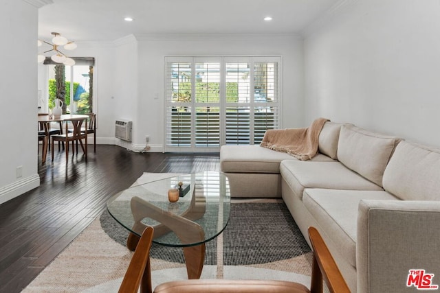 living room featuring dark wood-type flooring, ornamental molding, and a wall mounted AC