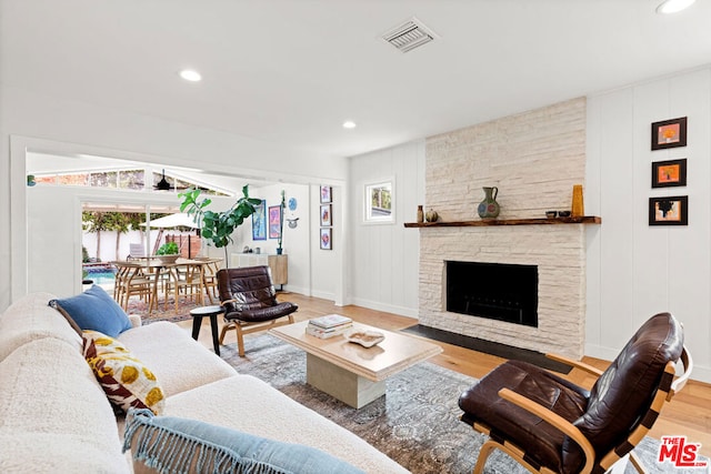 living room featuring a fireplace and hardwood / wood-style floors