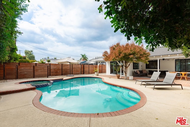 view of pool with an in ground hot tub, a pergola, and a patio area