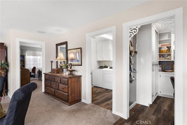 corridor featuring dark hardwood / wood-style flooring and independent washer and dryer