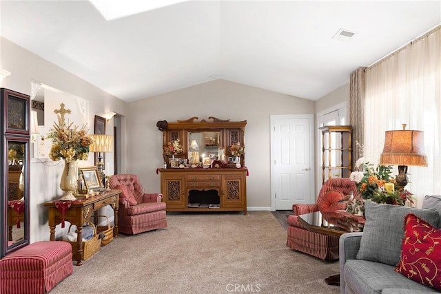 living room featuring light colored carpet, lofted ceiling, and a wealth of natural light