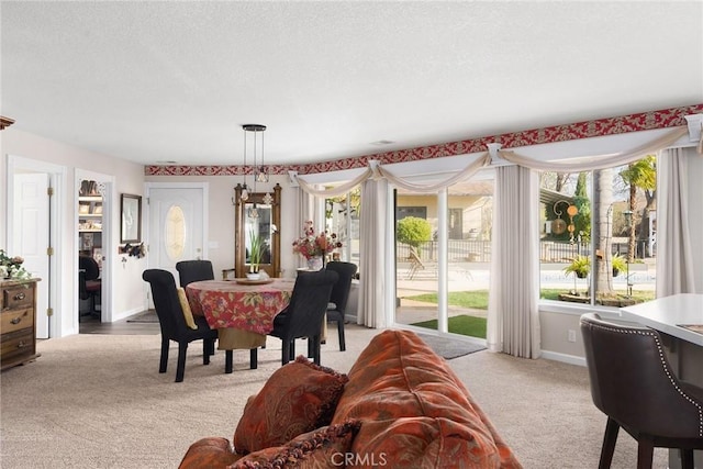 dining space with light colored carpet