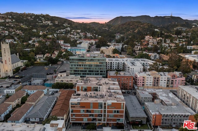 aerial view at dusk with a mountain view