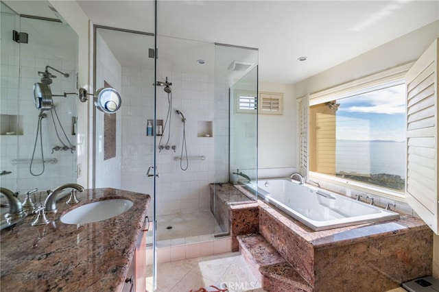 bathroom featuring tile patterned flooring, vanity, and separate shower and tub