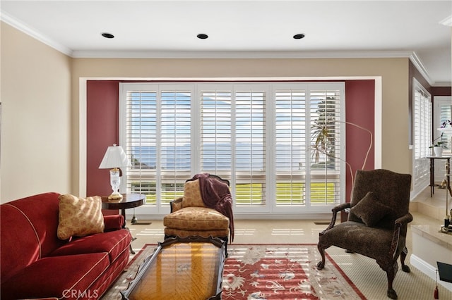 sitting room featuring crown molding, plenty of natural light, and carpet flooring