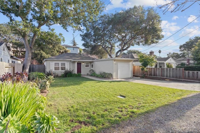 ranch-style house featuring a garage and a front yard