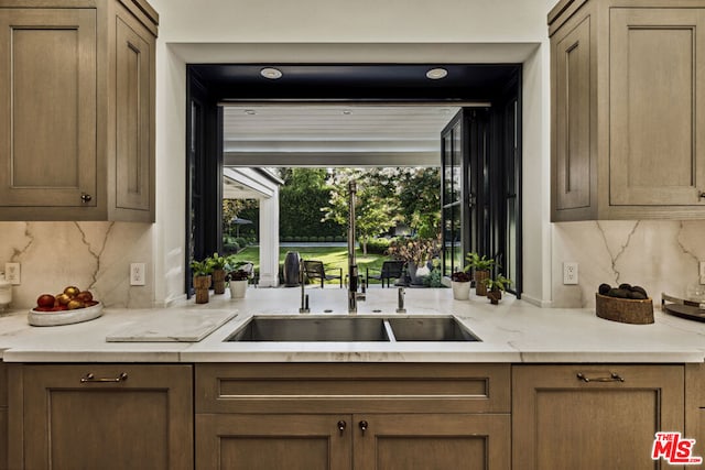 kitchen featuring sink and decorative backsplash