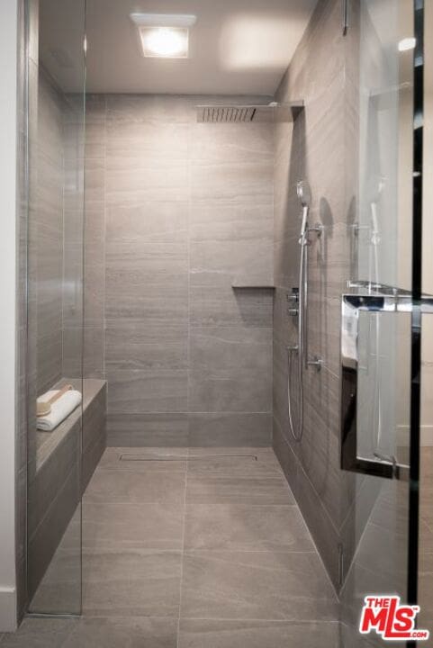 bathroom with a shower with shower door