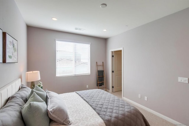 bedroom with light colored carpet