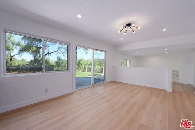 spare room featuring light hardwood / wood-style flooring