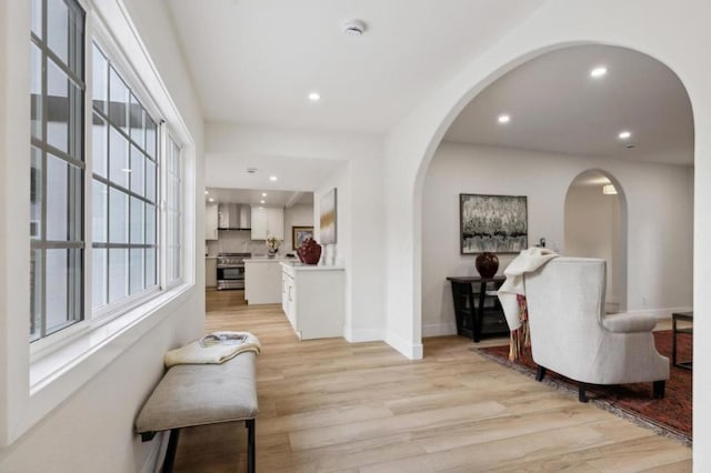 corridor with light hardwood / wood-style flooring