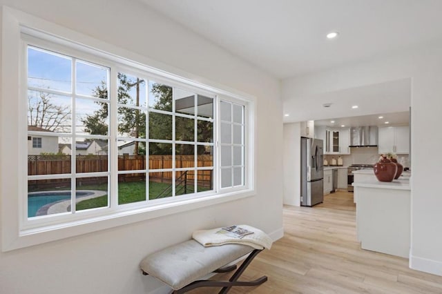 sitting room featuring plenty of natural light and light wood-type flooring