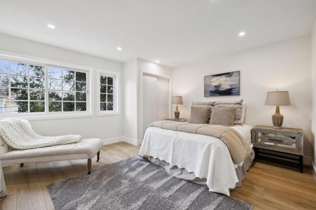 bedroom with light hardwood / wood-style floors