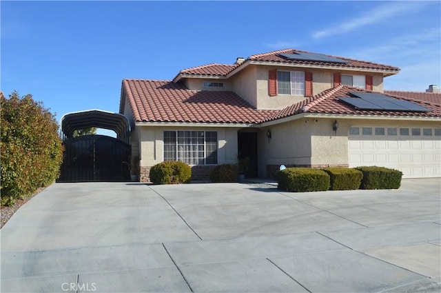 view of front of property featuring a garage and solar panels