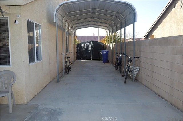 view of vehicle parking with a carport