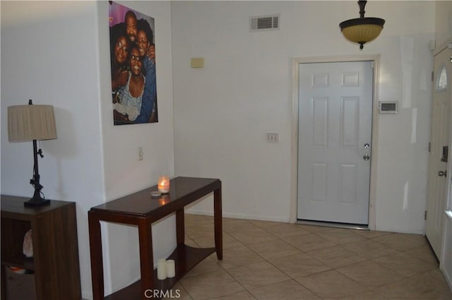 entryway featuring light tile patterned floors