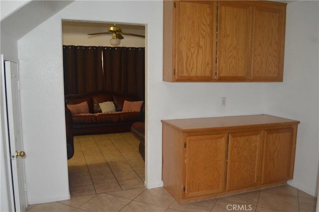 kitchen with light tile patterned floors and ceiling fan