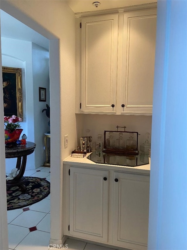 bar with white cabinetry