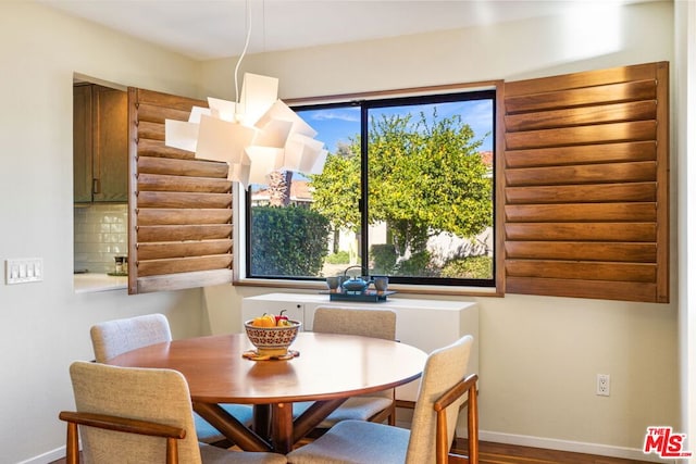 dining area featuring plenty of natural light and hardwood / wood-style floors