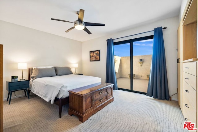 bedroom with access to outside, light colored carpet, and ceiling fan