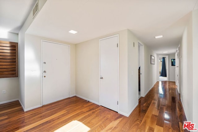 foyer entrance featuring hardwood / wood-style floors