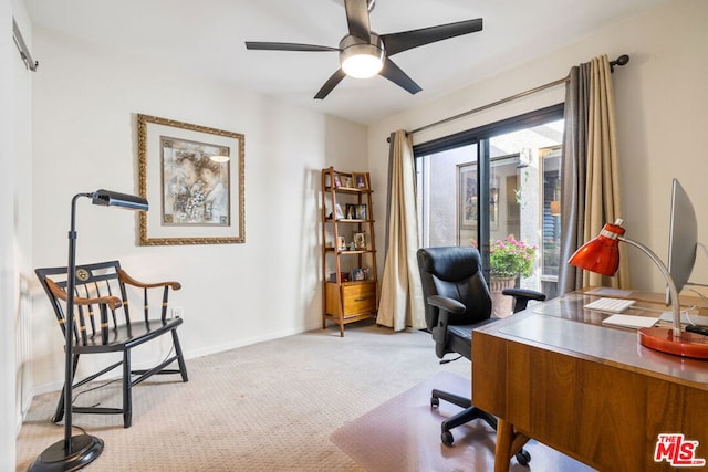 office space featuring light colored carpet and ceiling fan