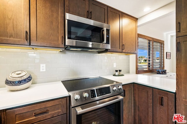 kitchen featuring backsplash and stainless steel appliances