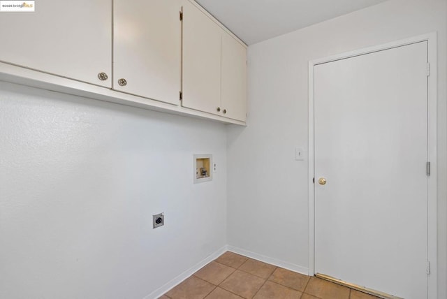 laundry room featuring washer hookup, cabinets, hookup for an electric dryer, and light tile patterned flooring