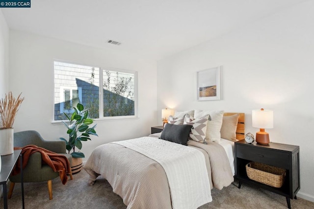 bedroom featuring light colored carpet