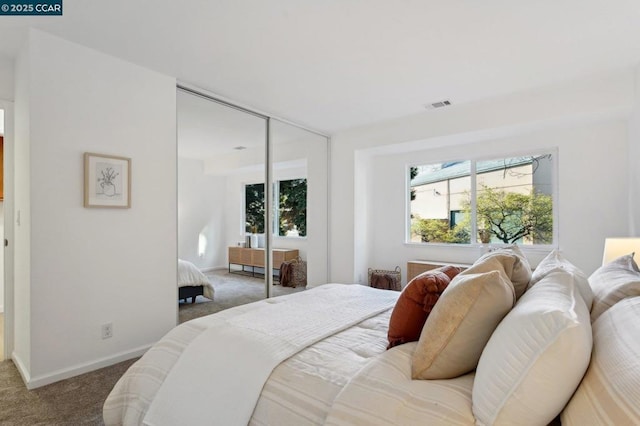 carpeted bedroom featuring a closet