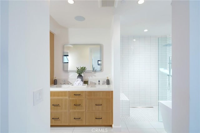 bathroom featuring tile patterned floors, vanity, and independent shower and bath