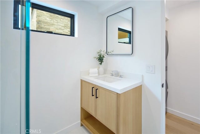 bathroom with vanity and wood-type flooring